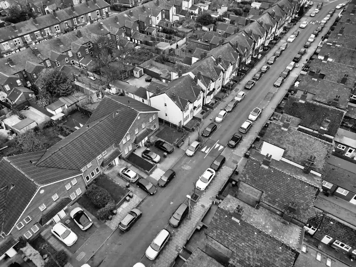 Aerial view of a Victorian terraced street with slate roofs and long back additions, similar to the terraces of north Croydon